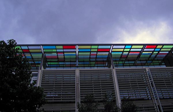 a building with rainbow awning