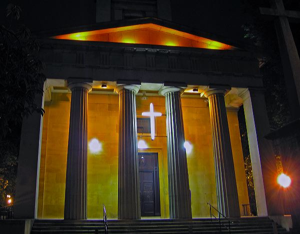 a church with a neon cross